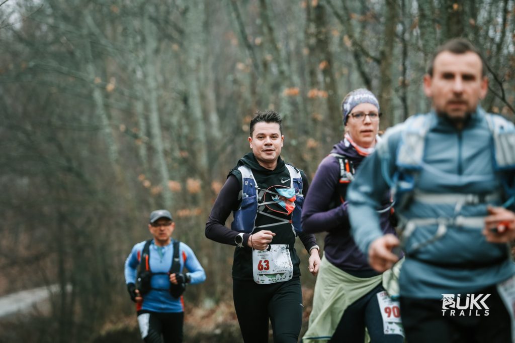 Runner with bib number 63 on the trail